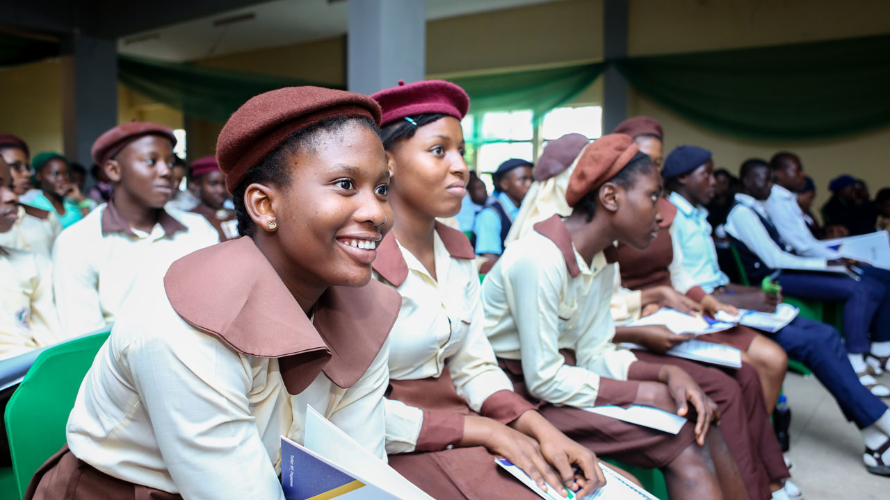 Adolescent schoolchildren sitting and focused on a lecture in class