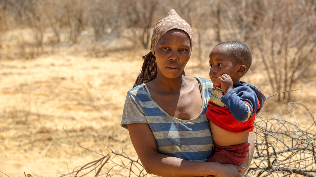 A mother holding her toddler
