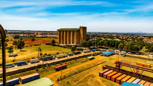 View of a tall industrial building at the edge of a Kenyan city