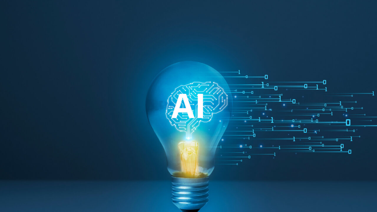 Image of an artificial intelligence (AI) brain with circuit board lines inside a light bulb